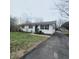 Charming single story home featuring a well-maintained lawn and a long driveway at 1024 Foltz St, Indianapolis, IN 46241