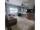 Comfortable living room featuring neutral walls, a ceiling fan, and carpet at 1024 Foltz St, Indianapolis, IN 46241
