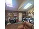 Office space with skylights, wood paneling, and desk area at 1024 Foltz St, Indianapolis, IN 46241