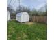 Backyard showing a well-maintained storage shed and partial wooden fence at 1024 Foltz St, Indianapolis, IN 46241