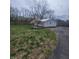 Well-maintained backyard with storage shed and decorative flowering trees at 1024 Foltz St, Indianapolis, IN 46241