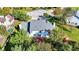 Aerial shot of a home showcasing its roof, deck, and surrounding lush greenery in a residential area at 10401 Monarch Ct, Noblesville, IN 46060