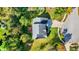 Overhead shot presenting a house featuring its roof, backyard, and the adjacent vibrant green scenery at 10401 Monarch Ct, Noblesville, IN 46060