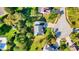 An aerial view of a well-maintained home with lush backyard landscaping in a peaceful residential neighborhood at 10401 Monarch Ct, Noblesville, IN 46060