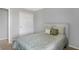 Bedroom with neutral walls and carpet, furnished with a bed featuring floral bedding and a white headboard at 10401 Monarch Ct, Noblesville, IN 46060