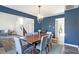 Spacious dining room with a chandelier, table with seating for six, and hardwood floors at 10401 Monarch Ct, Noblesville, IN 46060