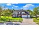 Beautiful brick home with a three-car garage and lush green lawn at 10401 Monarch Ct, Noblesville, IN 46060
