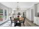 Open-concept kitchen with an island, stainless appliances, dining area and backyard access at 10401 Monarch Ct, Noblesville, IN 46060