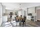 Spacious kitchen with stainless steel appliances, dining area and bar with wine fridge at 10401 Monarch Ct, Noblesville, IN 46060