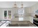 Bright, remodeled kitchen featuring an island, quartz countertops, and stainless appliances at 10401 Monarch Ct, Noblesville, IN 46060
