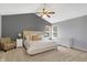 Spacious main bedroom featuring neutral colors, vaulted ceilings, ceiling fan, and natural light at 10401 Monarch Ct, Noblesville, IN 46060