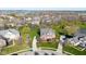 Expansive aerial view of a charming neighborhood with lush green lawns near a scenic lake at 10611 Proposal Pointe Way, Fishers, IN 46040