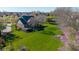 Spacious backyard with lush greenery, a wooden deck, and mature trees offering plenty of shade at 10611 Proposal Pointe Way, Fishers, IN 46040