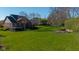 Expansive backyard featuring a large grassy area and a deck, perfect for outdoor activities and relaxation at 10611 Proposal Pointe Way, Fishers, IN 46040