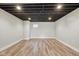 Unfurnished basement featuring recessed lights, wood-look flooring, and neutral paint at 10611 Proposal Pointe Way, Fishers, IN 46040