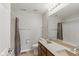 Bathroom featuring double vanity and shower with decorative curtain at 10611 Proposal Pointe Way, Fishers, IN 46040