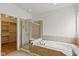 Beautiful bathroom with soaking tub, glass enclosed shower, and large walk-in closet at 10611 Proposal Pointe Way, Fishers, IN 46040