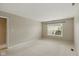 Neutral bedroom featuring carpet and a window for natural lighting at 10611 Proposal Pointe Way, Fishers, IN 46040