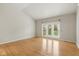 Bedroom with sliding glass door to patio and lots of natural light at 10611 Proposal Pointe Way, Fishers, IN 46040