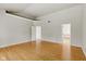 Spacious bedroom with neutral walls and wood floors and ensuite bathroom at 10611 Proposal Pointe Way, Fishers, IN 46040