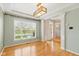 Dining room with hardwood floors, tray ceiling, and large window at 10611 Proposal Pointe Way, Fishers, IN 46040