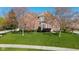 Beautiful two-story brick home featuring a well-manicured lawn and lovely landscaping at 10611 Proposal Pointe Way, Fishers, IN 46040