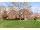 Charming brick two-story home with manicured lawn and mature trees at 10611 Proposal Pointe Way, Fishers, IN 46040