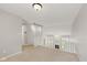Upstairs hallway with neutral carpet and view of living room below at 10611 Proposal Pointe Way, Fishers, IN 46040