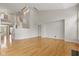 Bright living room with hardwood floors, high ceilings, and staircase at 10611 Proposal Pointe Way, Fishers, IN 46040