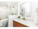 Bright bathroom with marble tile, modern vanity, soaking tub, and gold accents at 107 Northwood Dr, Fishers, IN 46038