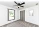 Neutral bedroom with carpet flooring, ceiling fan, closet, and natural light from a window at 107 Northwood Dr, Fishers, IN 46038