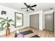 Converted bedroom with vinyl flooring, ceiling fan, yoga mat, weights, and natural light at 107 Northwood Dr, Fishers, IN 46038