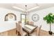 Elegant dining room with stylish chandelier, hardwood floors, and comfortable seating for memorable gatherings at 107 Northwood Dr, Fishers, IN 46038
