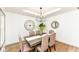 Elegant dining room with stylish chandelier, hardwood floors, and comfortable seating for memorable gatherings at 107 Northwood Dr, Fishers, IN 46038
