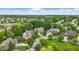 Expansive aerial view of the neighborhood featuring lush greenery and well-maintained homes on manicured lawns at 11974 Volcanic Rock Dr, Fishers, IN 46037