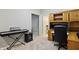 Spacious basement office featuring neutral carpeting, light paint, custom desk and access to bathroom at 11974 Volcanic Rock Dr, Fishers, IN 46037