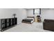 Finished basement bedroom area featuring neutral carpeting, natural light and desk space at 11974 Volcanic Rock Dr, Fishers, IN 46037