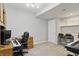 Basement office space featuring custom desk, built-in storage, neutral carpeting and light paint at 11974 Volcanic Rock Dr, Fishers, IN 46037