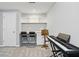 Bright basement featuring a workstation with built-in shelving, desks and chairs at 11974 Volcanic Rock Dr, Fishers, IN 46037