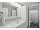 Bright bathroom with a modern vanity, and a view into the shower at 11974 Volcanic Rock Dr, Fishers, IN 46037