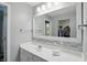 Bright bathroom with a large mirror, modern vanity, and a view into the closet at 11974 Volcanic Rock Dr, Fishers, IN 46037
