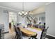 Open-concept dining area with chandelier and staircase views at 11974 Volcanic Rock Dr, Fishers, IN 46037
