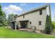 Charming home exterior featuring a covered patio with a fireplace, and a well-maintained lawn at 11974 Volcanic Rock Dr, Fishers, IN 46037