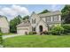 Beautiful two-story brick home boasts a manicured lawn and attached two car garage at 11974 Volcanic Rock Dr, Fishers, IN 46037