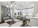 Spacious kitchen featuring granite countertops, gray island, stainless steel appliances, and adjoining dining area at 11974 Volcanic Rock Dr, Fishers, IN 46037