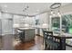Contemporary kitchen with gray island, stainless appliances, and open layout provides a modern cooking space at 11974 Volcanic Rock Dr, Fishers, IN 46037