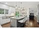 Modern kitchen featuring granite counters, stainless appliances, and open layout to dining area at 11974 Volcanic Rock Dr, Fishers, IN 46037