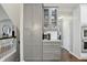Well-appointed kitchen featuring gray cabinets, granite countertops, and modern stainless steel appliances at 11974 Volcanic Rock Dr, Fishers, IN 46037