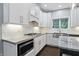 Stylish kitchen featuring white cabinetry, stainless steel appliances, and tile backsplash is perfect for cooking at 11974 Volcanic Rock Dr, Fishers, IN 46037