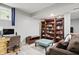 This room features a seating area, a desk area, and built-in shelving at 11974 Volcanic Rock Dr, Fishers, IN 46037